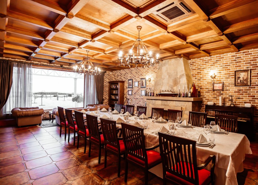 restaurant private room with table for 14 persons wooden ceiling brick walls and fireplace restaurant private room with table for 14 persons wooden ceiling brick walls and fireplace